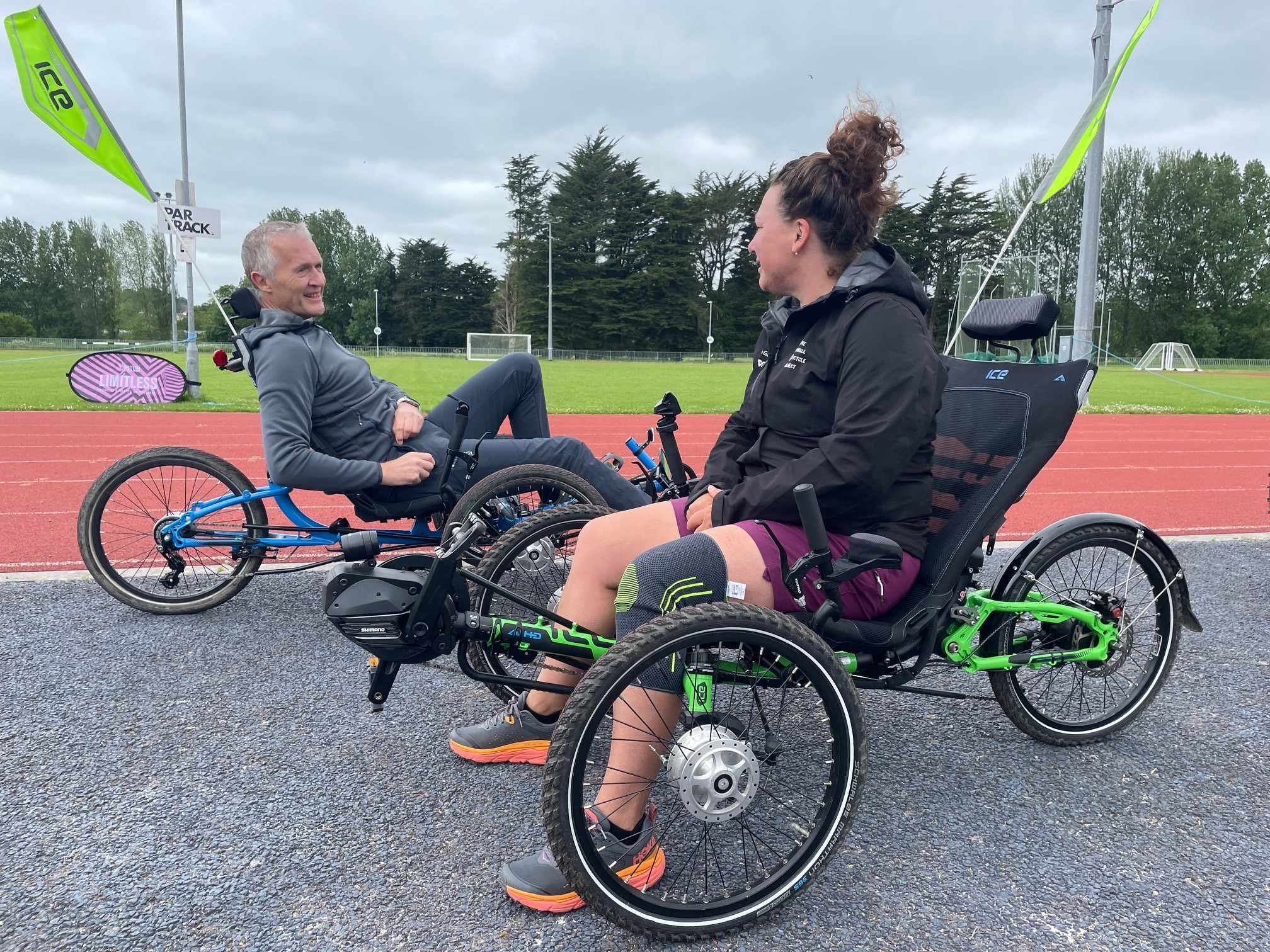 Two trike cyclists chatting